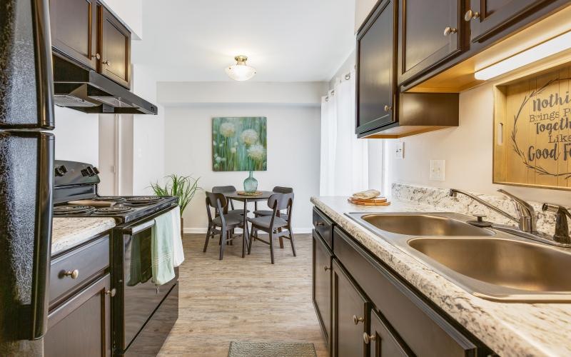 a kitchen with a dining room in view